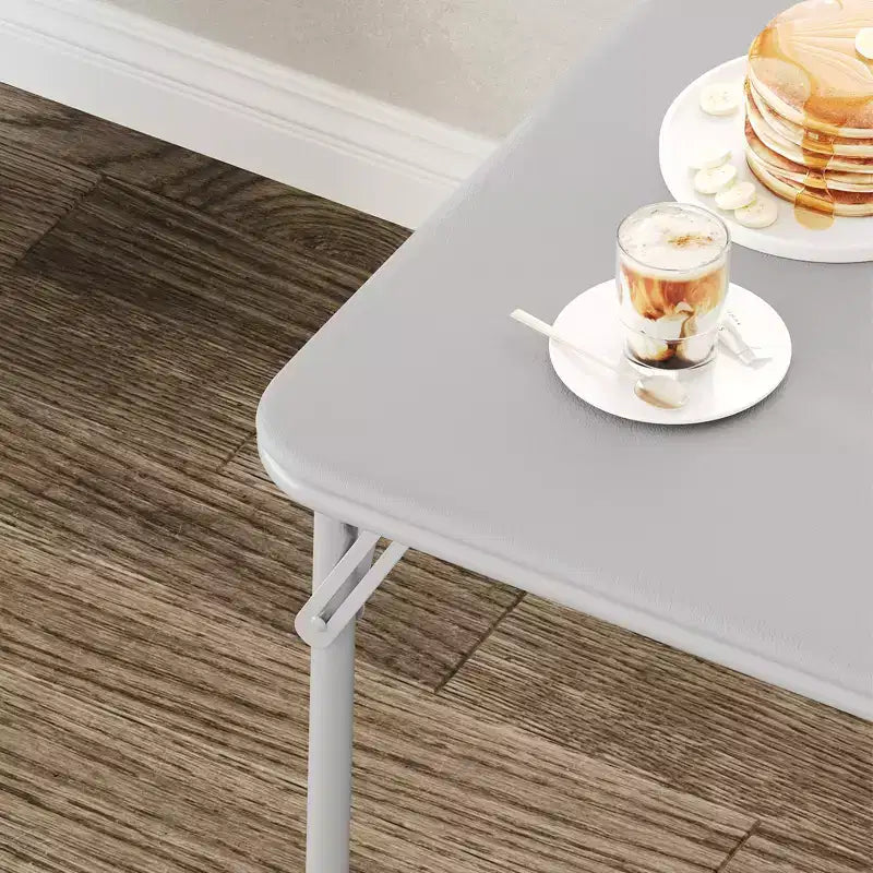 Tavolo pieghevole quadrato beige/nero/grigio, piano imbottito in PU, 4 posti