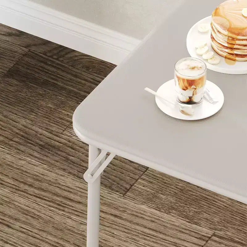 Tavolo pieghevole quadrato beige/nero/grigio, piano imbottito in PU, 4 posti